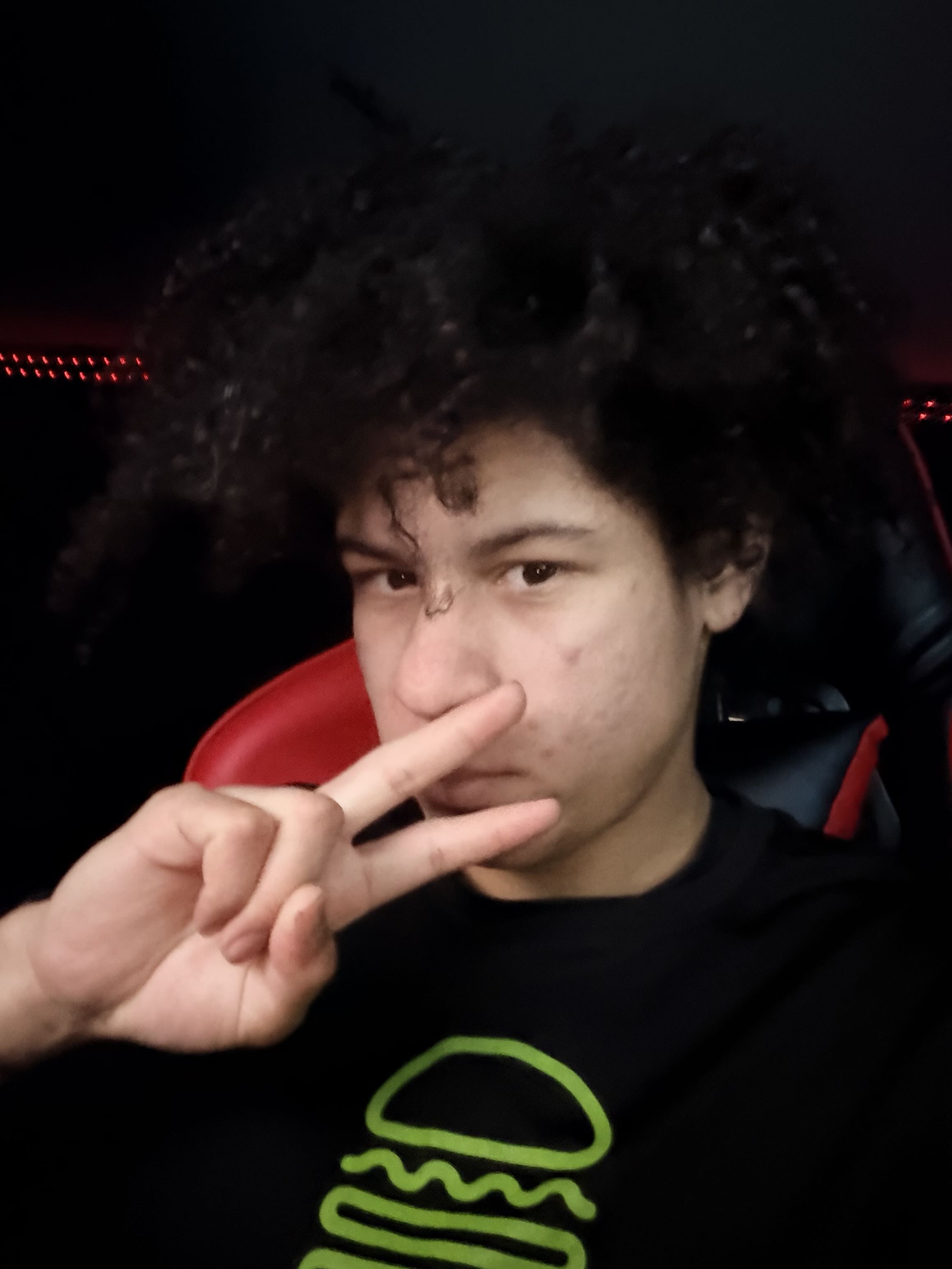 A selfie of Zuriel Delvillar in Shake Shack attire.